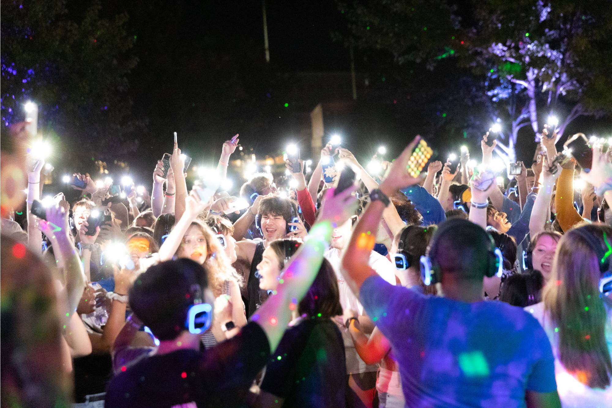 Students dancing and singing during a silent disco on Allendale campus